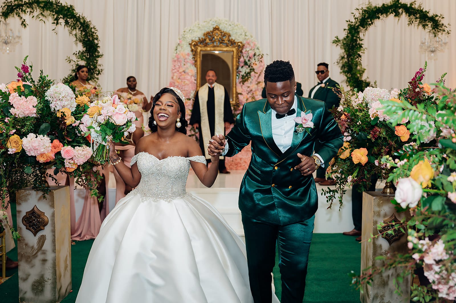 A garden reception with tall blush and ivory florals